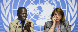 Member of the Commission of Inquiry on the 2014 Gaza conflict Doudou Diene (L) gestures next to Chairperson of the Commission Mary McGowan Davis during a press conference to present their report on June 22, 2015 at the United Nations Office in Geneva. Both Israel and Palestinian militants may have committed war crimes during last year's Gaza war, a widely anticipated United Nations report said on June 22, decrying "unprecedented" devastation and human suffering.   AFP PHOTO / FABRICE COFFRINI