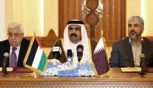 Qatari Emir Sheikh Hamad Bin Khalifa Al-Thani (C) Palestinian President Mahmoud Abbas (L) and Hamas leader Khaled Meshaal attend a ceremony in Doha, on February 6, 2012. Abbas will head an interim national consensus government under a deal signed in Qatar between Abbas and Meshaal , ending a long-running disagreement that had stalled Palestinian reconciliation. AFP PHOTO/STR (Photo credit should read -/AFP/Getty Images)