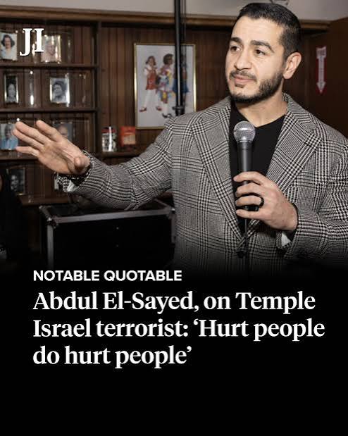 Abdul El-Sayed speaking with a microphone at an event, discussing the impact of trauma and violence.